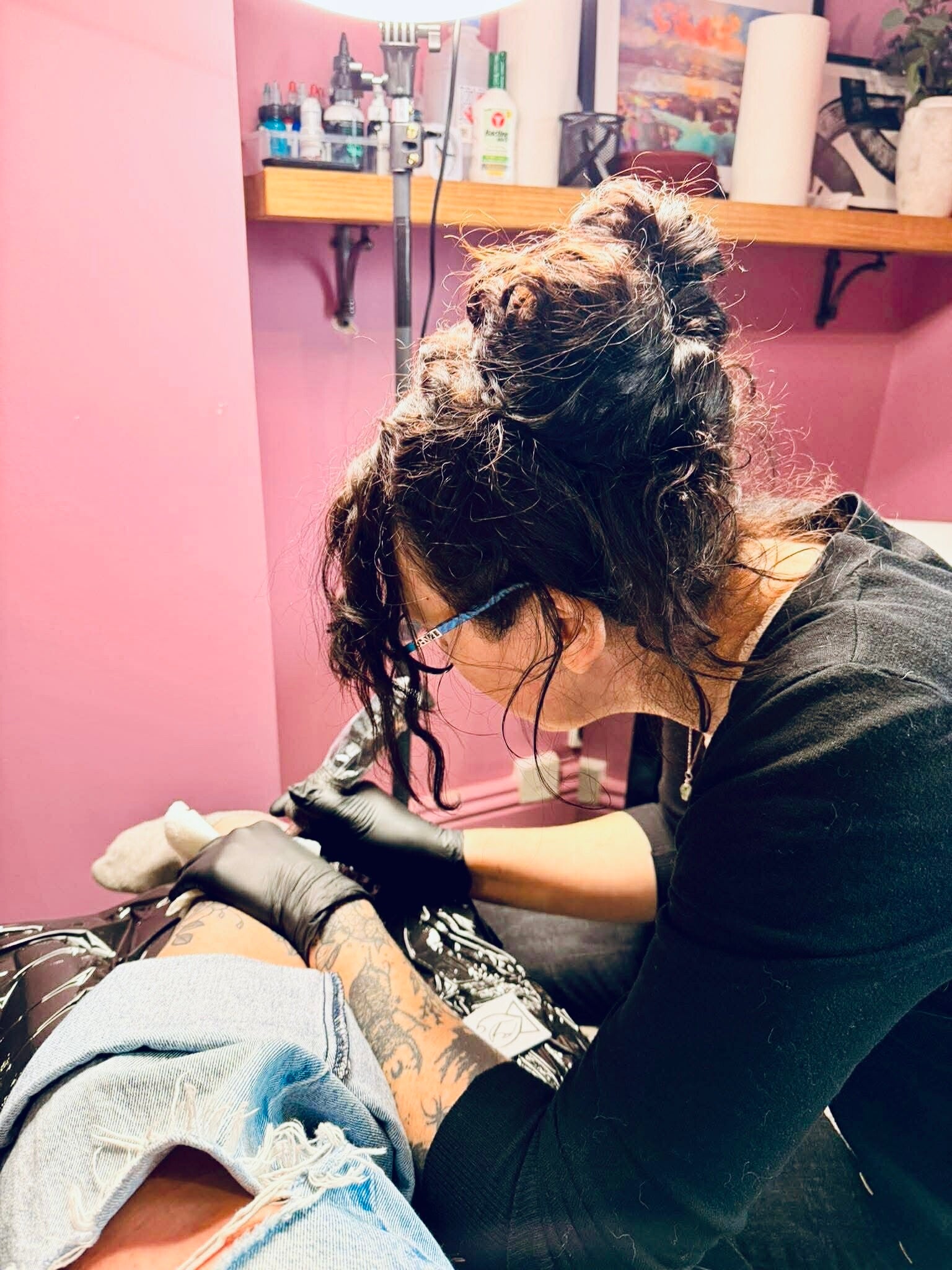 Inky Bones tattooing a client in the llandudno studio, north wales