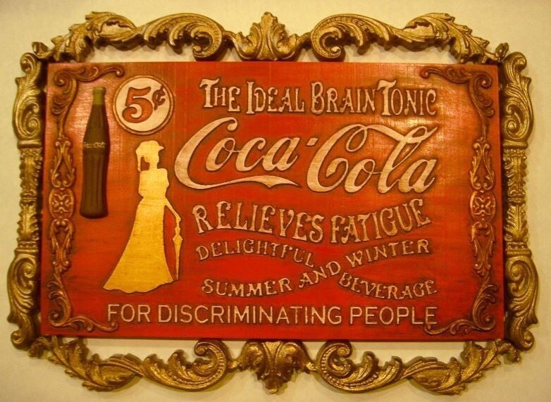 A vintage Coca-Cola advertisement marketing the drink as a brain tonic — the corporation naming exactly what it was designed to do