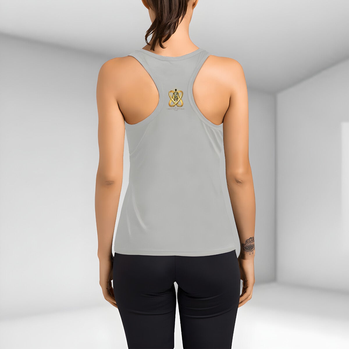 Grey racerback tank on a model, back view. The interlocking jewelled gold ring emblem repeats small between the shoulder blades with CHRISTTHETRUELIGHT.COM beneath it.