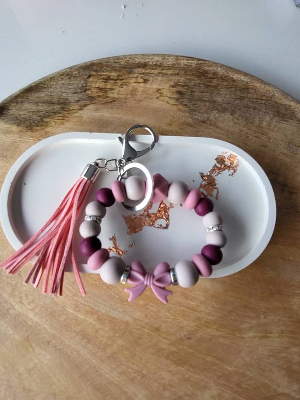 ronde sleutelhanger roze strik