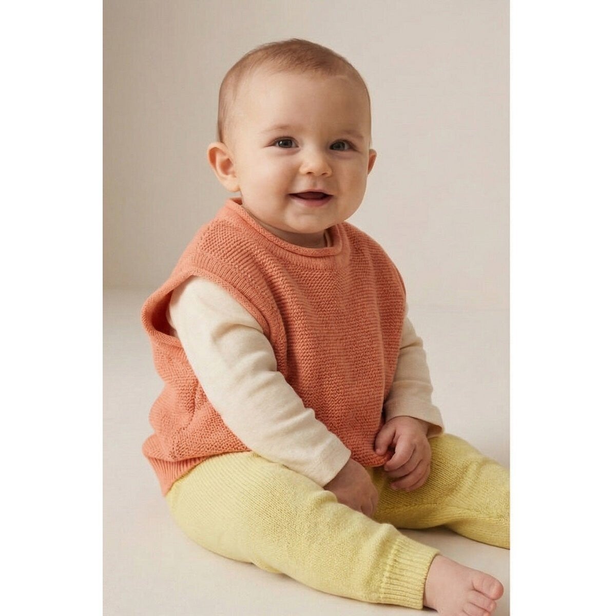 Lille Barn: Baby Spencer van merinowol - Peach Fuzz