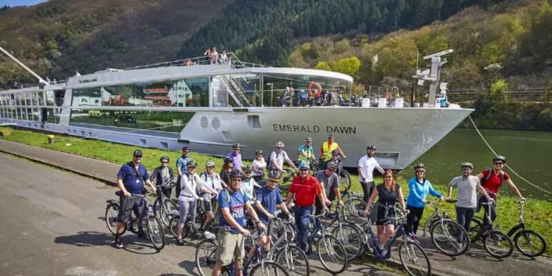 Small group of travelers enjoying a scenic river cruise together, illustrating the comfort and value of group travel.