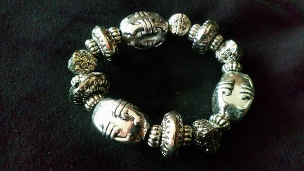 Armband zilverkleurig Fleur de Lys, plastic