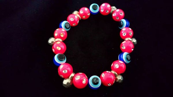 Armband roze kralen met Turks oog