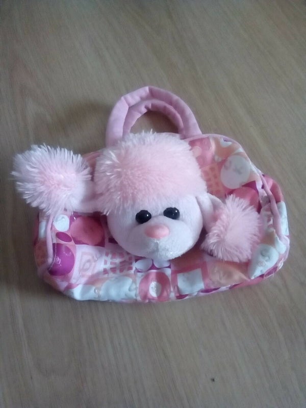Handbag with stuffed animal
