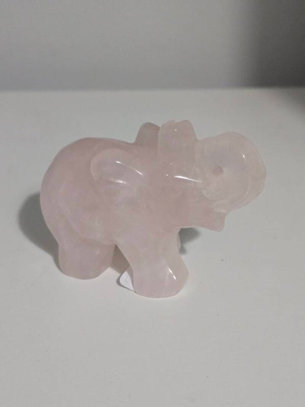 Rose quartz with golden healer elephant carving K24