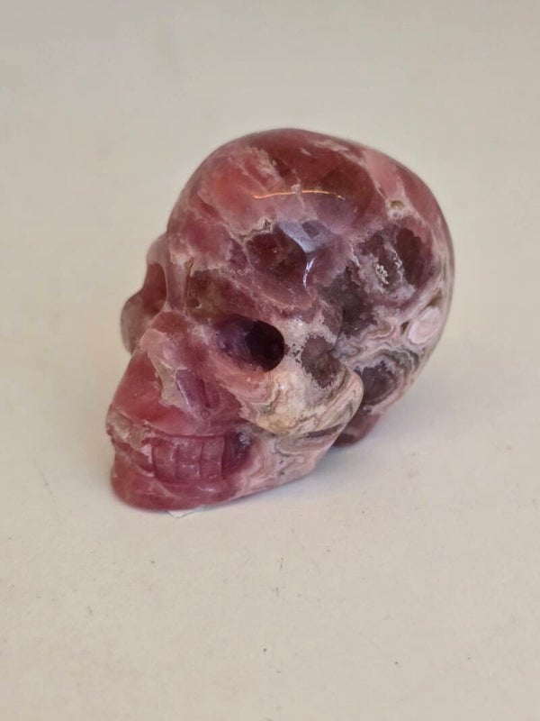 Rhodocrosite Skull Carving D169