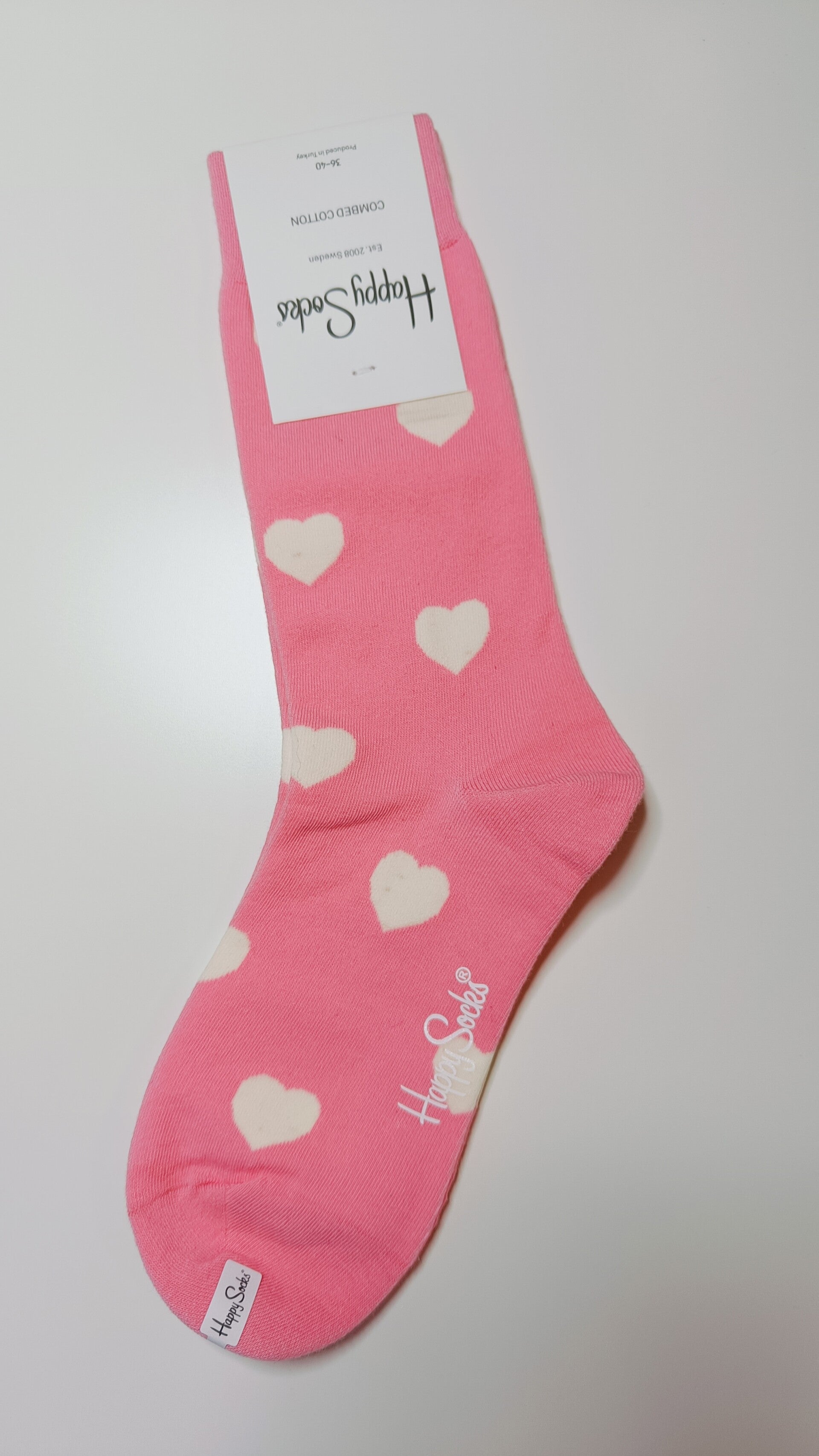 Sokken: roze met witte hartjes