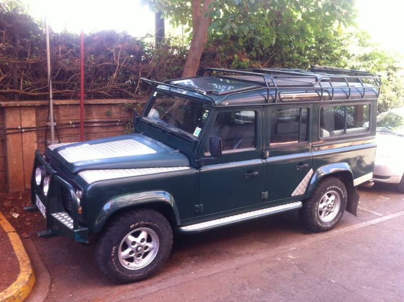 Marcel Romdane’s Land Rover Defender parked in Nairobi — a beautifully deceptive British vehicle that shattered spines, dreams, and the myth of reliable colonial engineering. From Riches to Rags, An African Odyssey Part 15