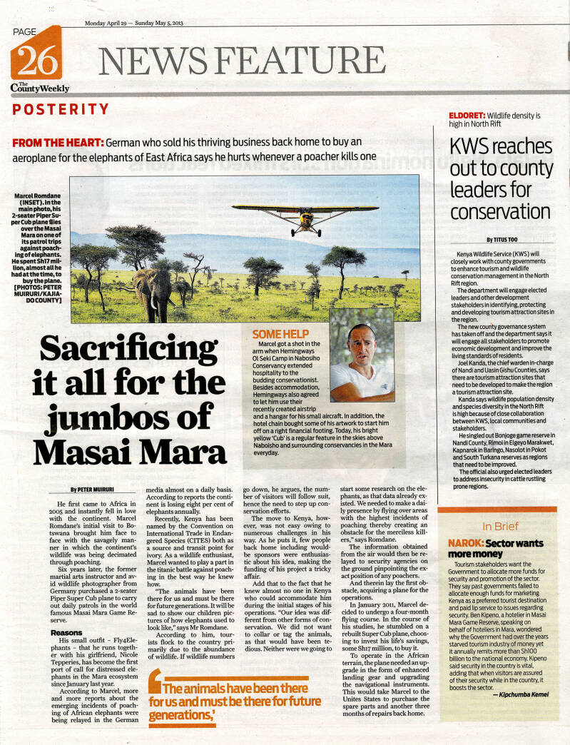 Newspaper feature from The County Weekly about Marcel Romdane and Fly4Elephants, showing a Piper Super Cub flying above an elephant in the Maasai Mara and highlighting aerial patrols for elephant conservation in Kenya.
