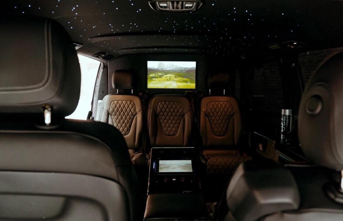 Luxury passenger interior from Hyde Platinum Travels chauffeur service with premium seating and entertainment