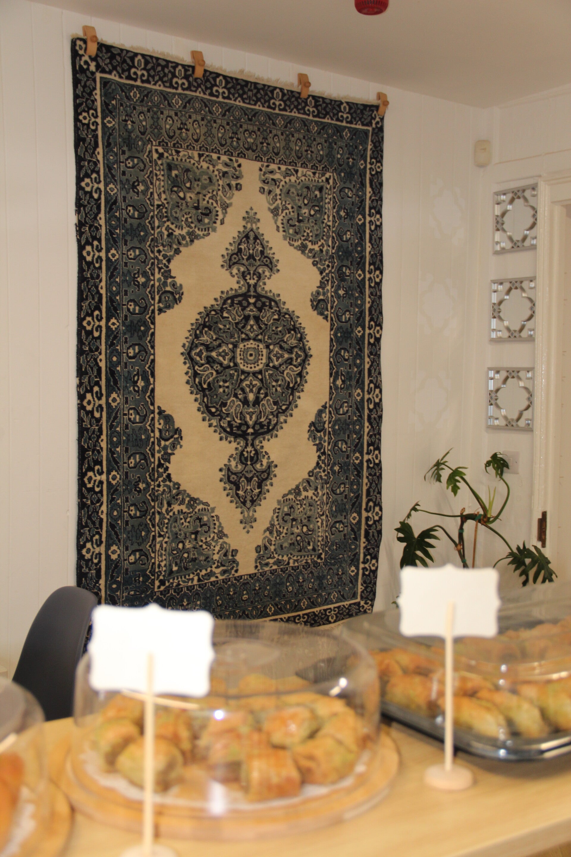 Persian rug on wall in Cafe Shiraz