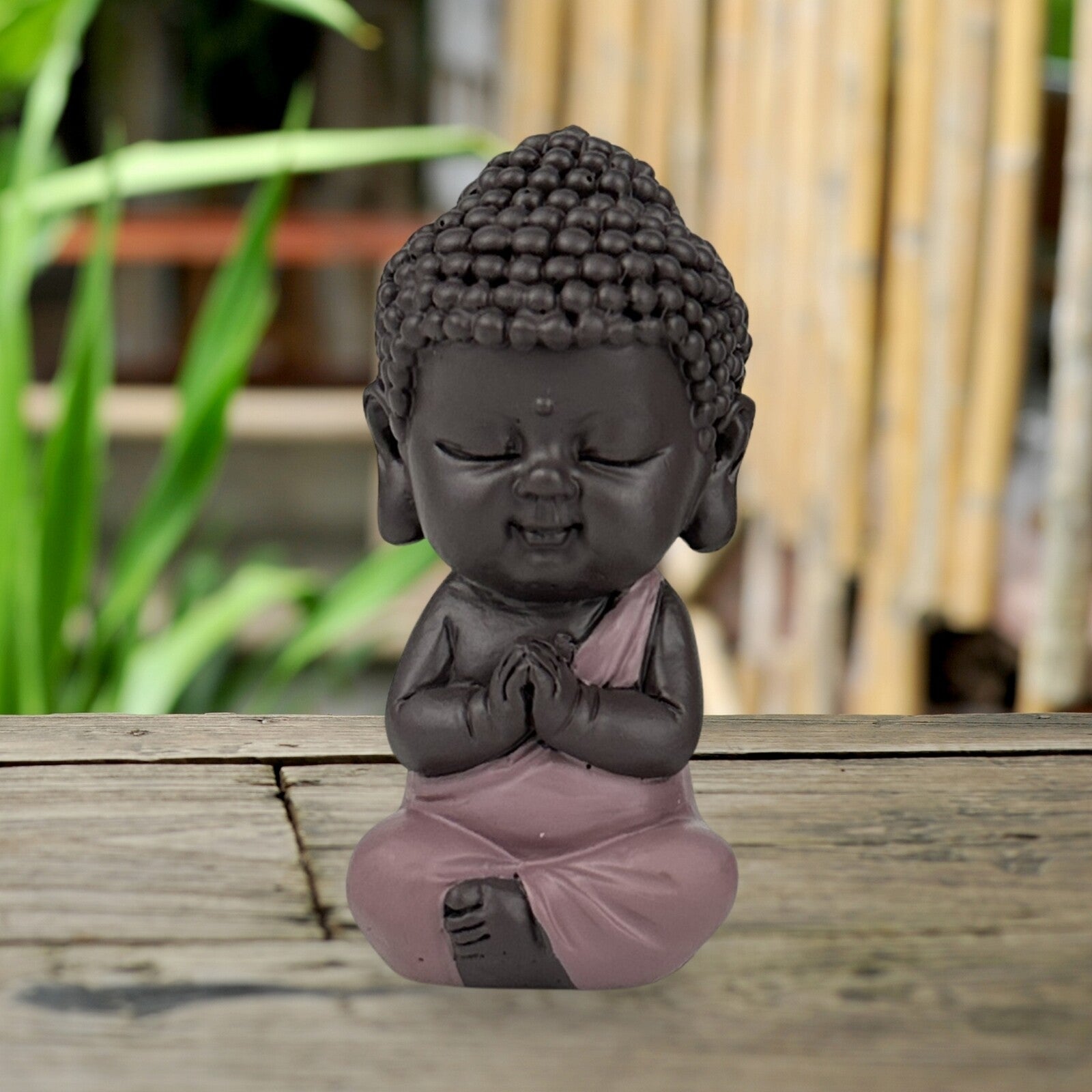Buddha beeldje roze toga