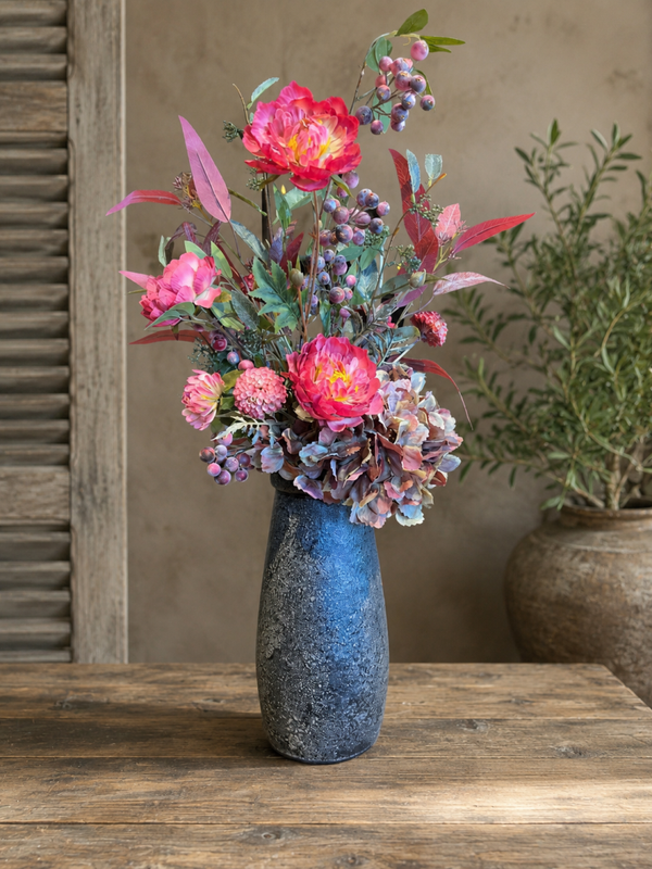 Vaas met zijdebloemen – warme tinten