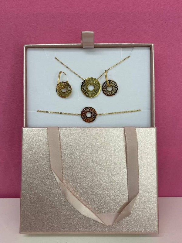 Conjunto dorado tipo flor solar del osito