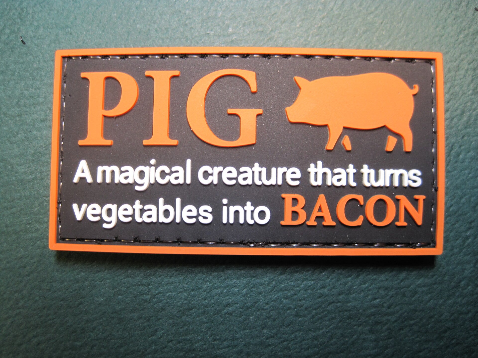 PIG A MAGICIAL CREATURE THAT TURNS VEGGIE'S INTO BACON PATCH PVC HOOK BACK