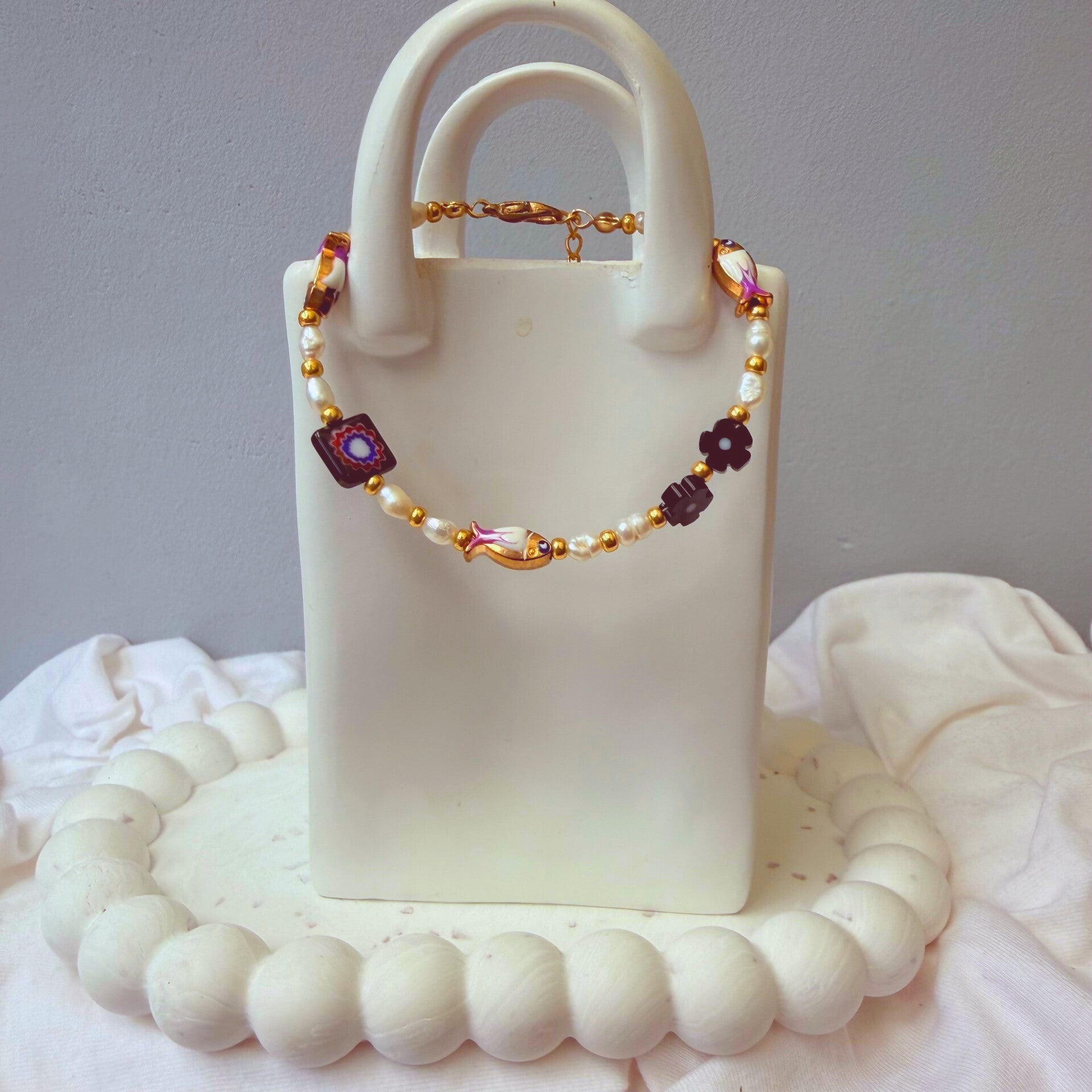 armbanden - visjes collectie 17 cm Upper goudkleurige visjes zwarte bloem