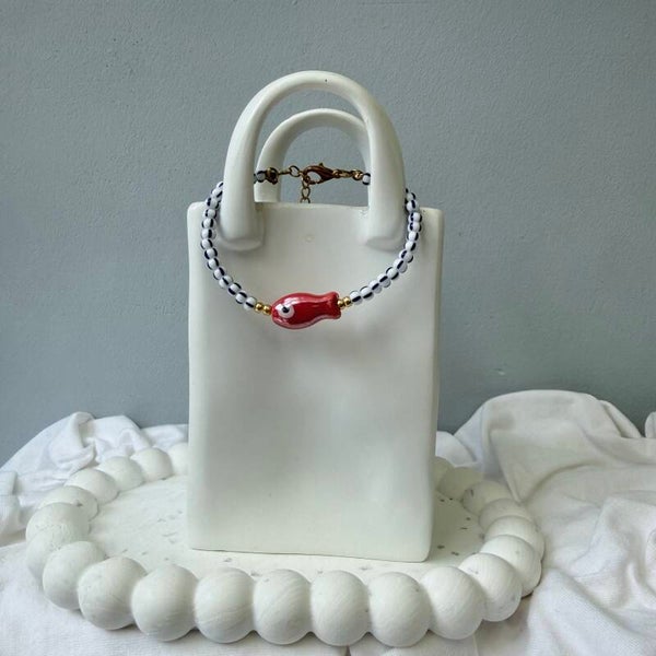 armbanden - visjes collectie ; rood visje blauw/wit gestreept goud
