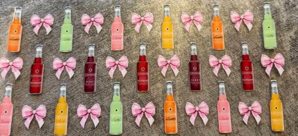 Wine bottles with pink bows