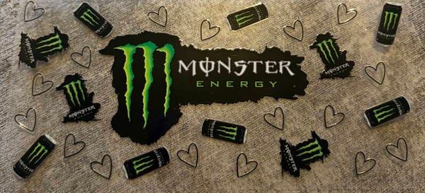 Green and black monster with hearts