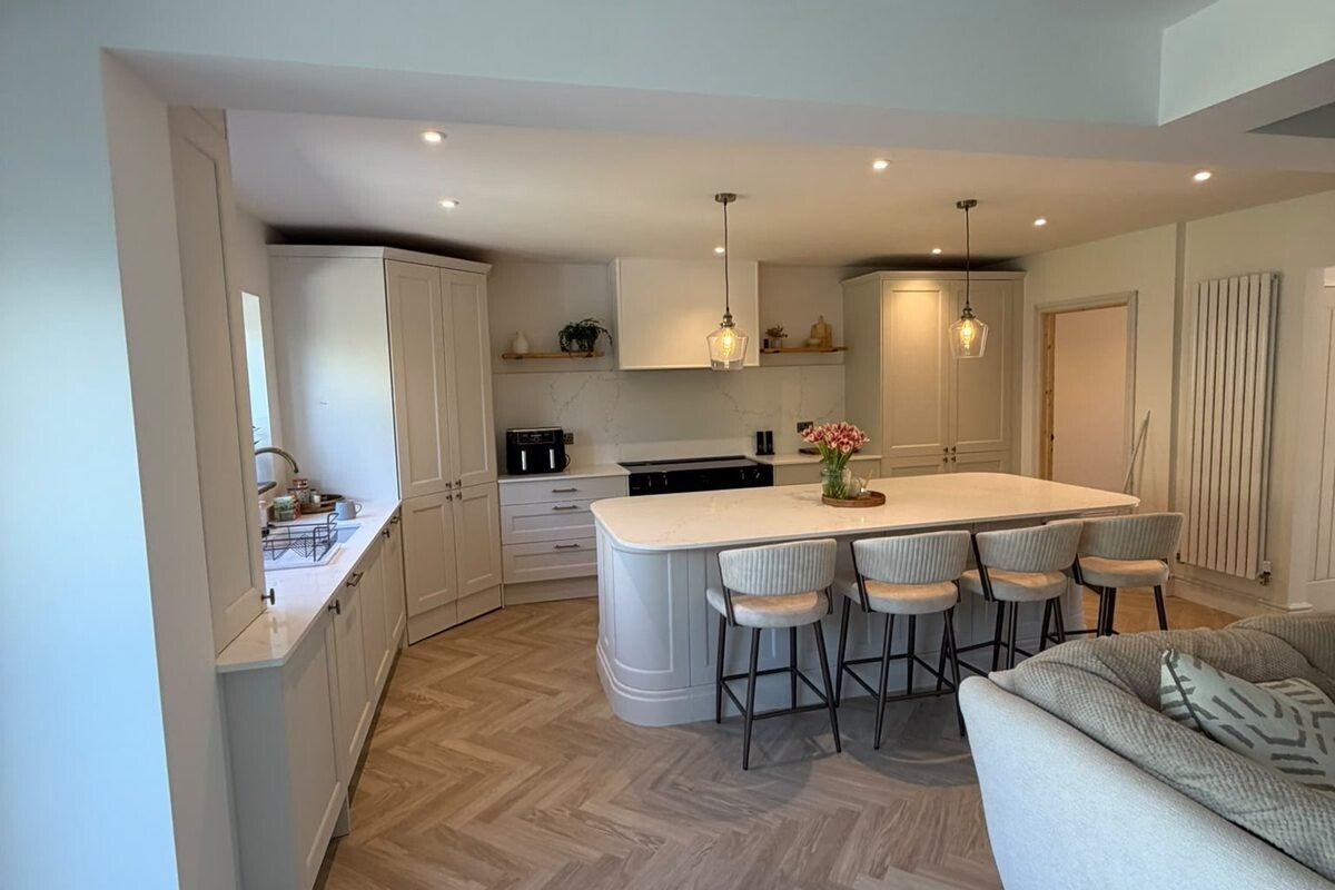 Fitted shaker-style kitchen with island and worktop