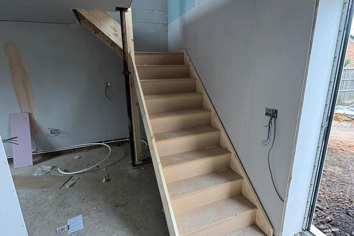 Timber staircase installation, treads fitted