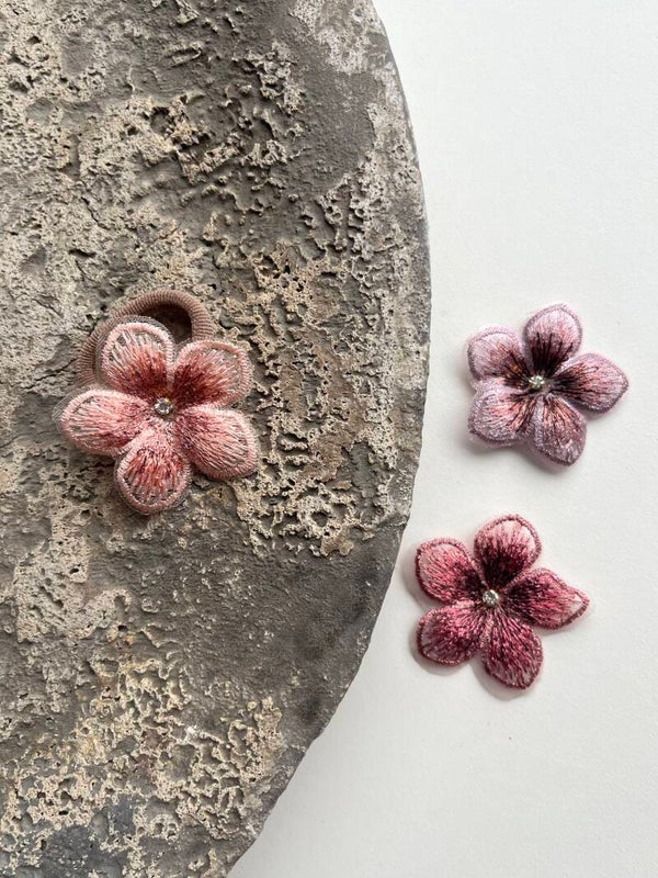 Elastiek met glitter bloem (1 stuk)