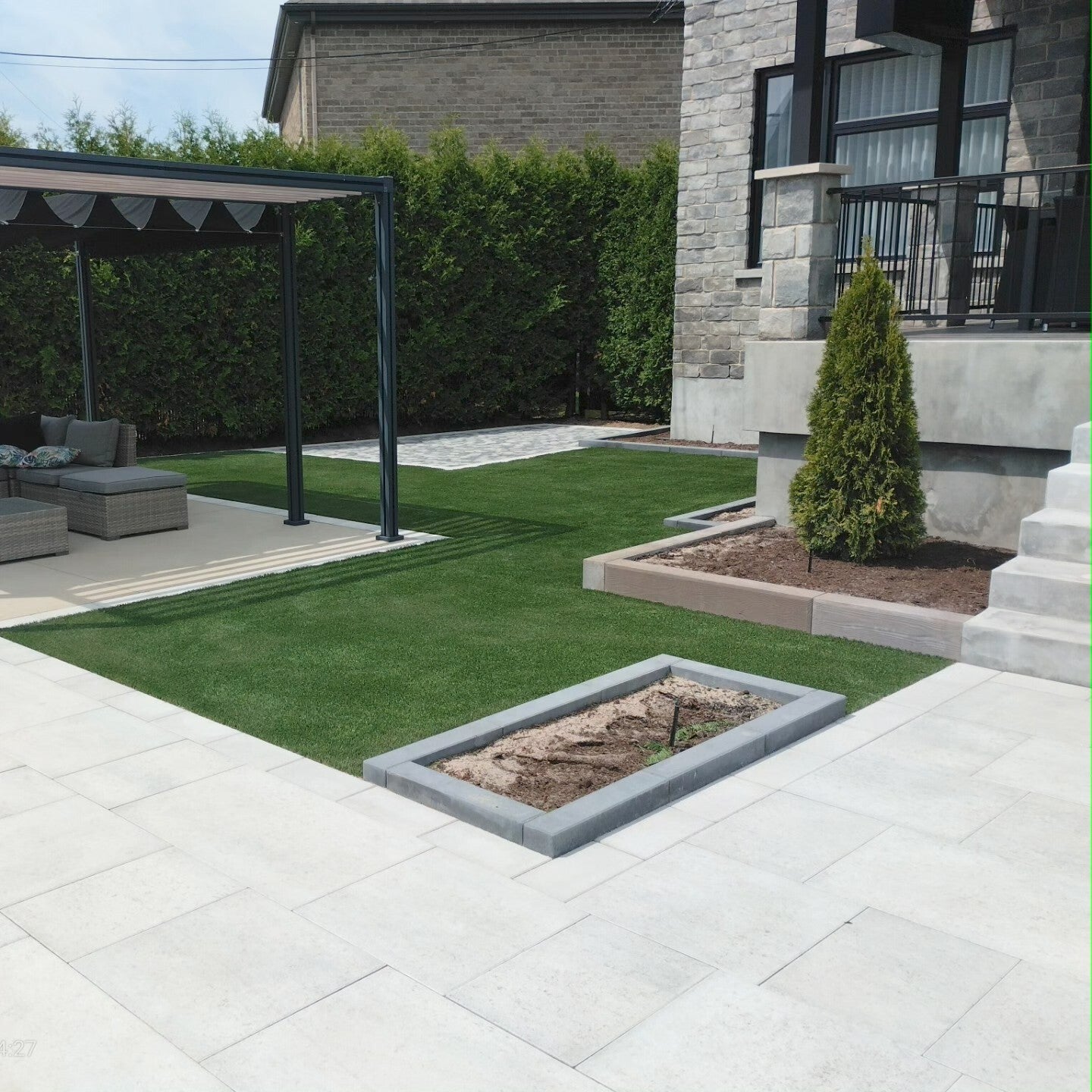 Backyard installation of artificial grass in Saint-Thérèse, Quebec