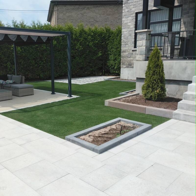 Backyard installation of artificial grass in Saint-Thérèse, Quebec