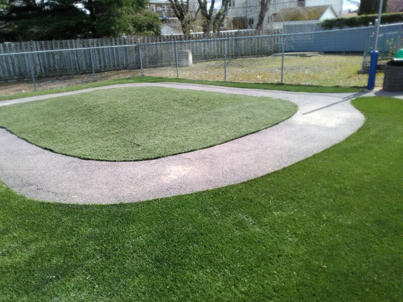 Daycare playground in Candiac, Quebec with newly installed artificial grass
