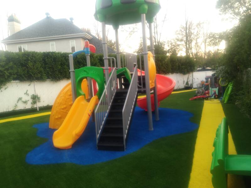 "Colorful artificial grass installation at a daycare in Laval, Quebec"