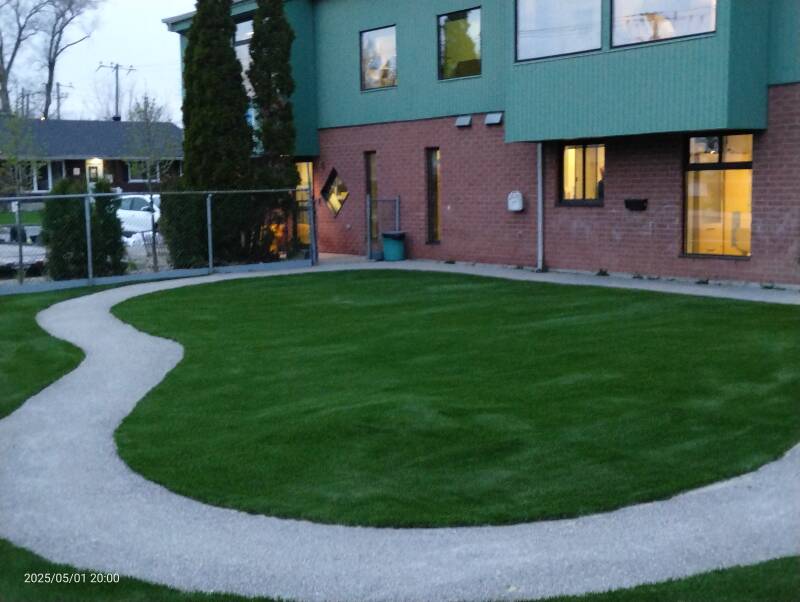 Artificial turf installed around sandbox at Candiac CPE daycare