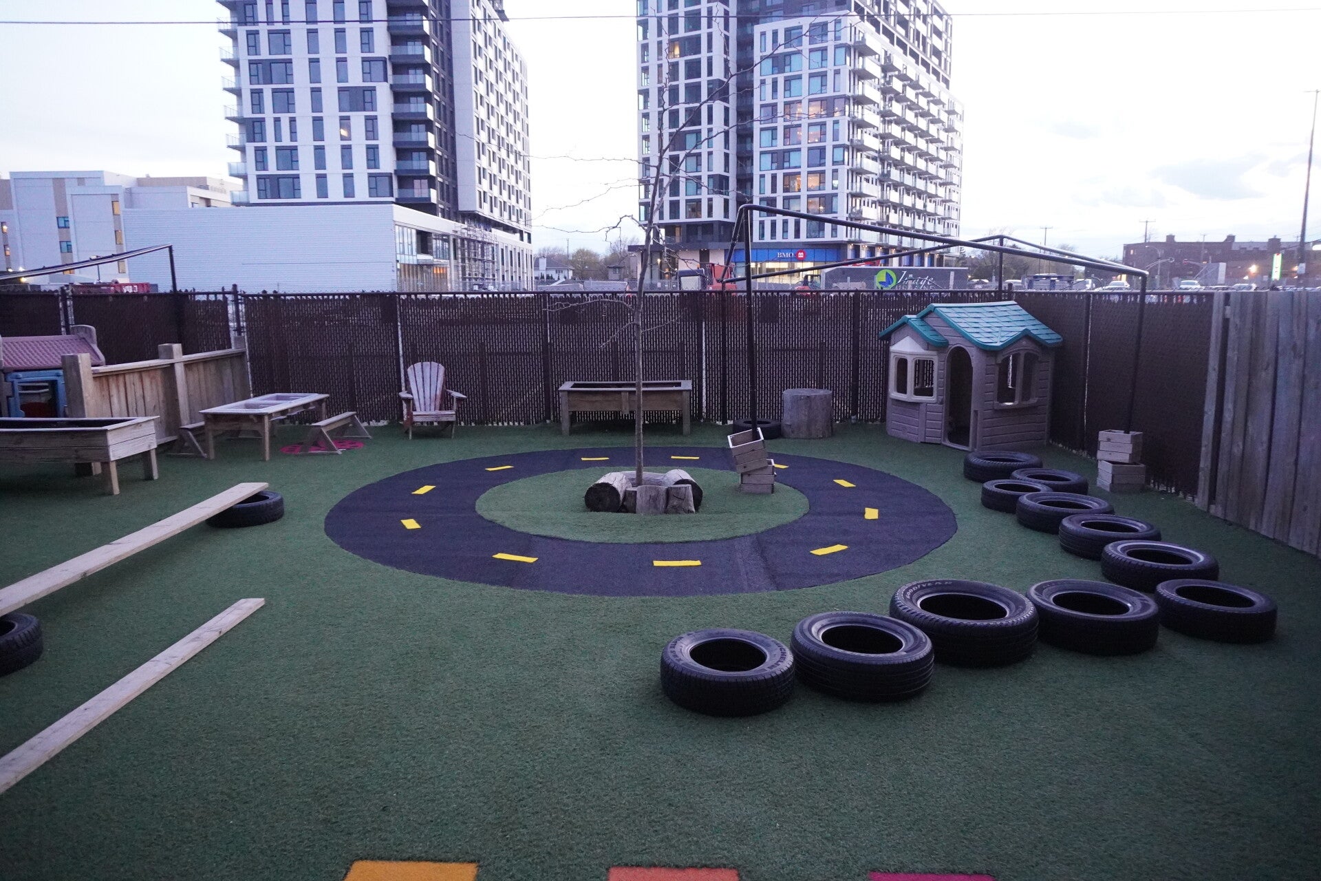 Daycare playground in Morin-Heights, Quebec with artificial grass and safety design surfacing