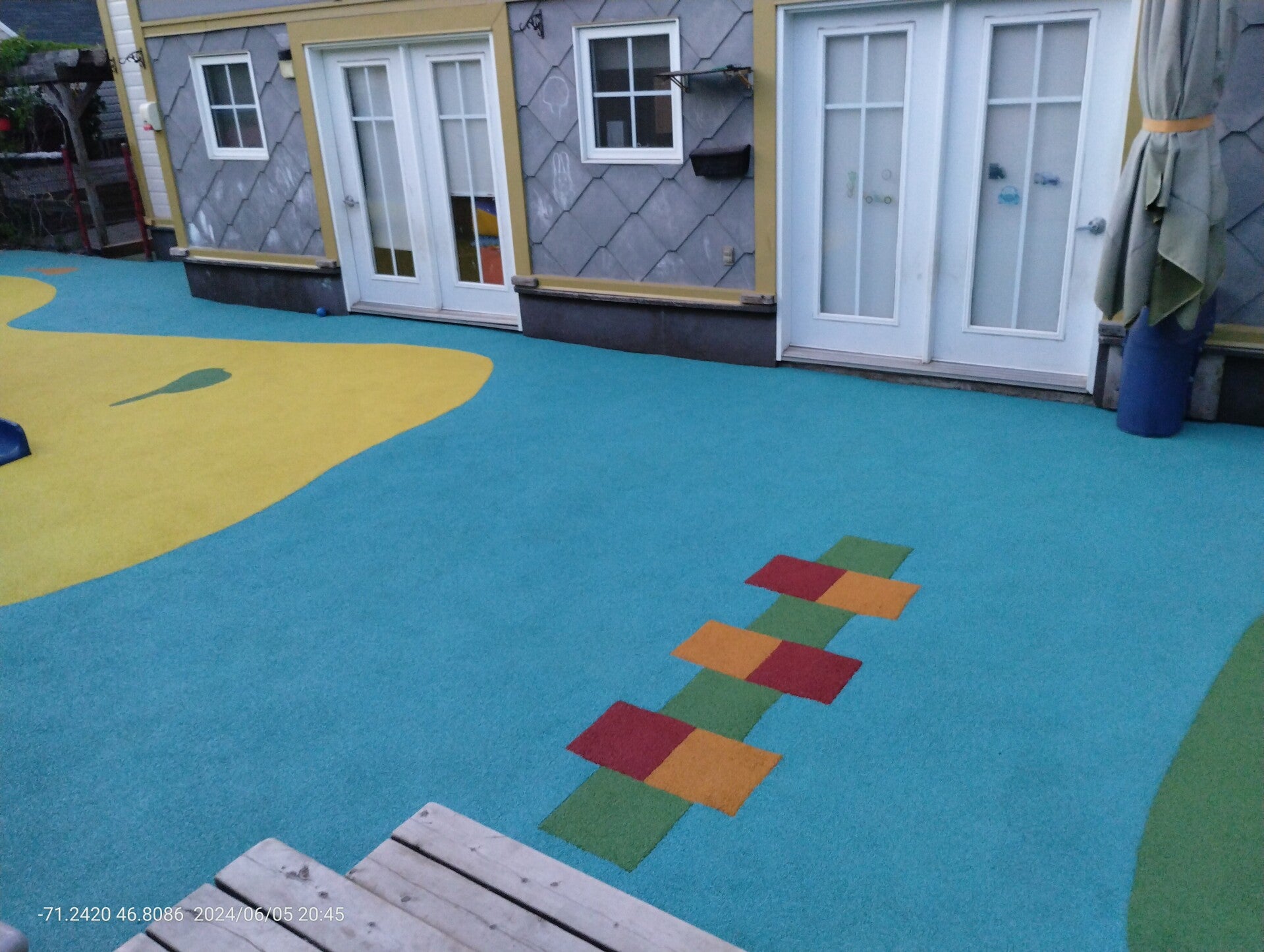 Playground at Quebec City daycare with rubber safety surface