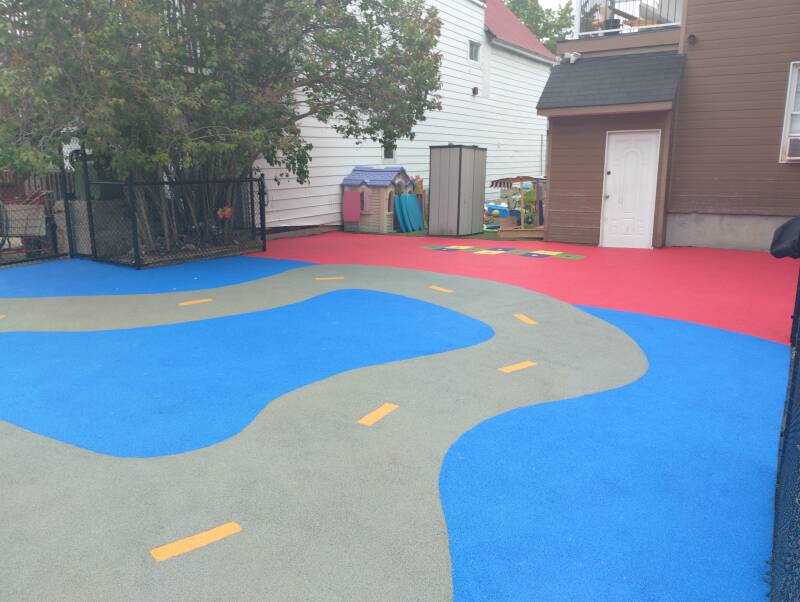 "Safe rubber playground surface at a daycare"