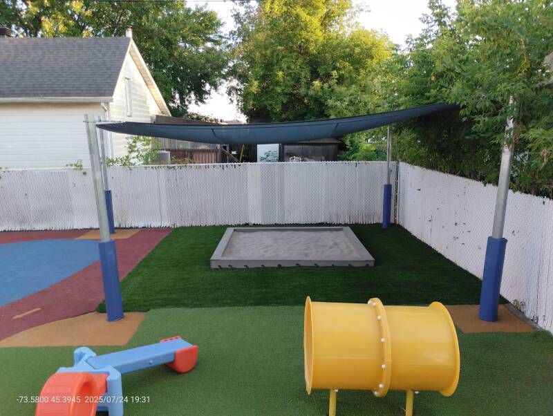 Daycare sandbox with artificial grass at CPE in Châteauguay, Quebec
