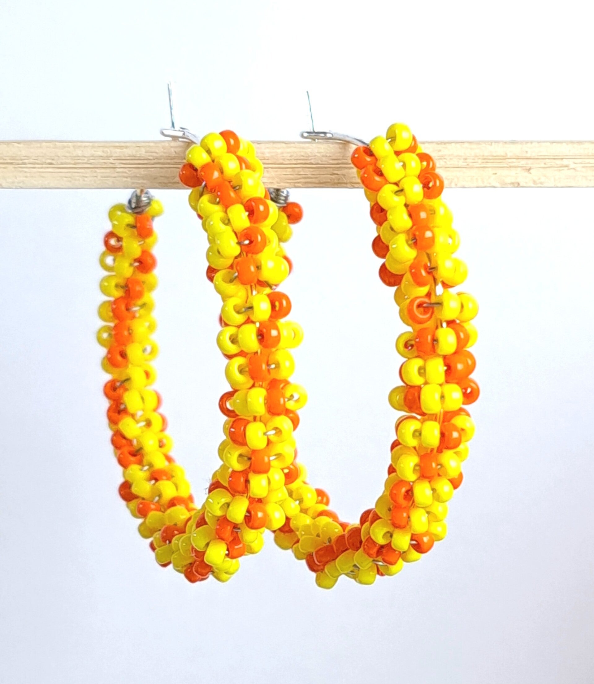 Creool oorbellen fel geel/oranje MAAT S