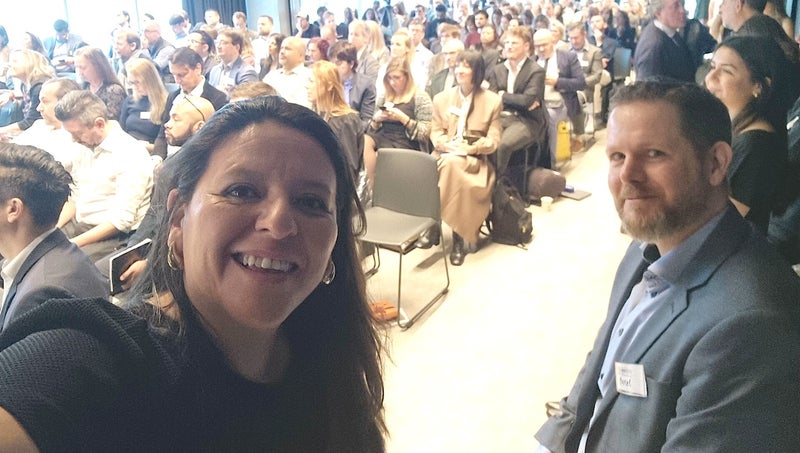Marisol & Marcel selfie with audience at WOIC 2023 in Bilbao, Spain