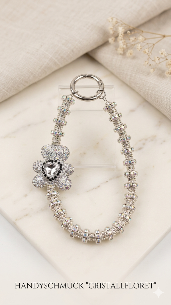 Luxuriöser Handy-Anhänger „Cristallfloret“ in Silber-Optik – Stylischer Handyschmuck fürs Handgelenk   (Für Frauen)