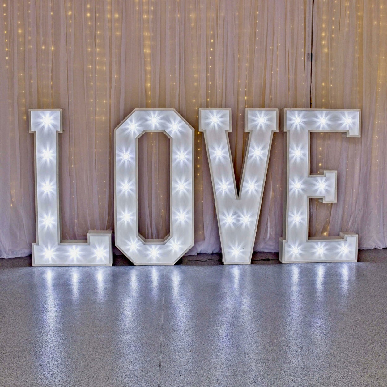 Illuminated four-foot LOVE letters available as an MHX wedding enhancement