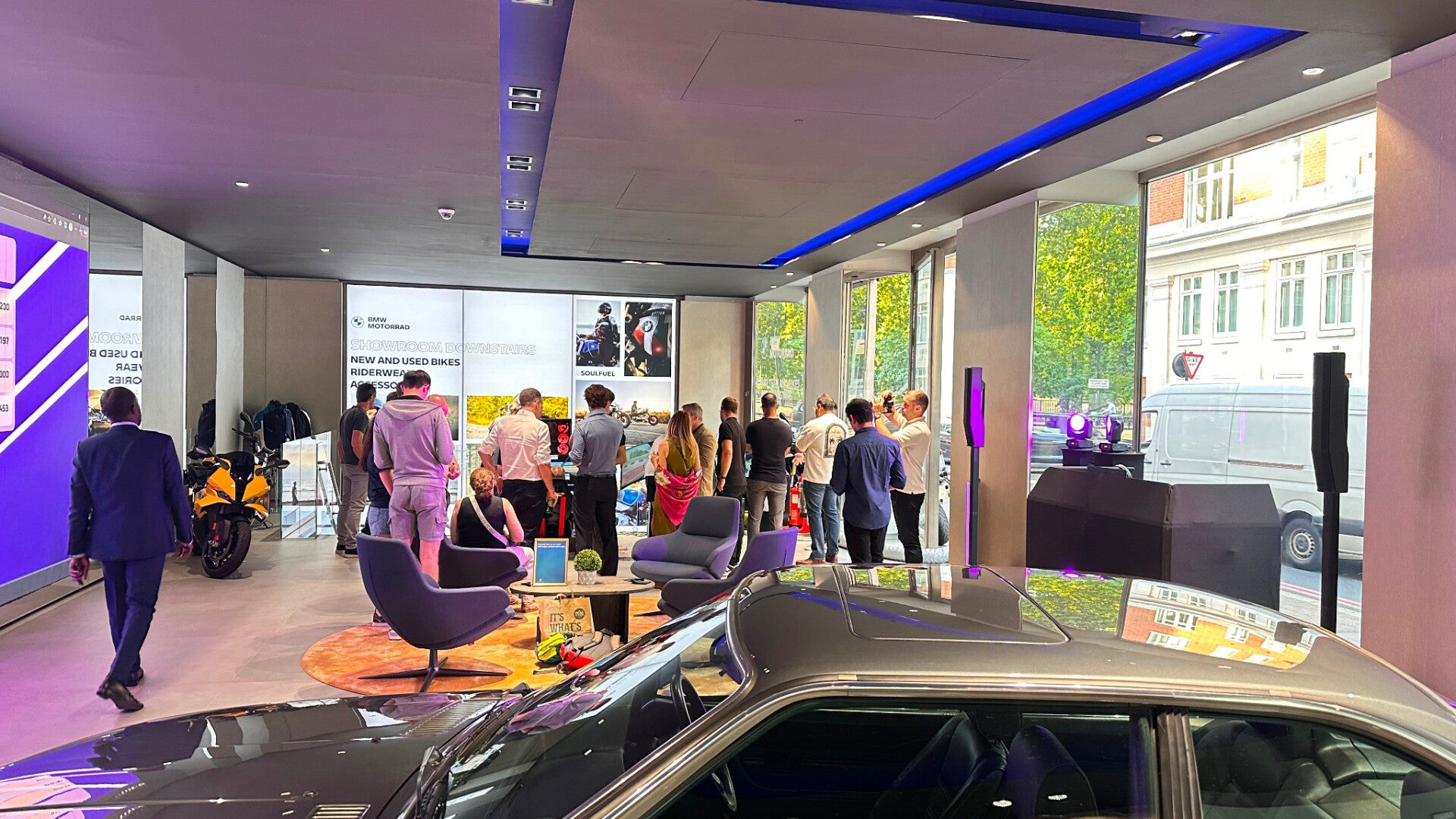 Guests and cars inside BMW Park Lane during the M Sport event