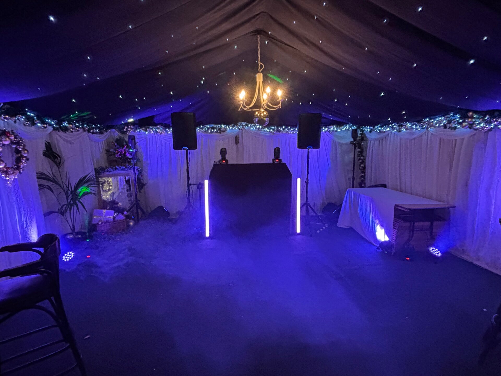 Corporate DJ setup with professional sound and lighting