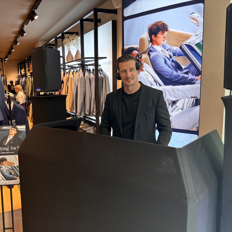 Matt Hall behind the MHX DJ booth at a retail event