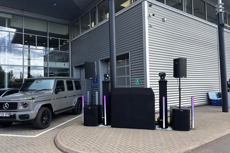 Black MHX DJ booth and speakers at a Mercedes automotive event