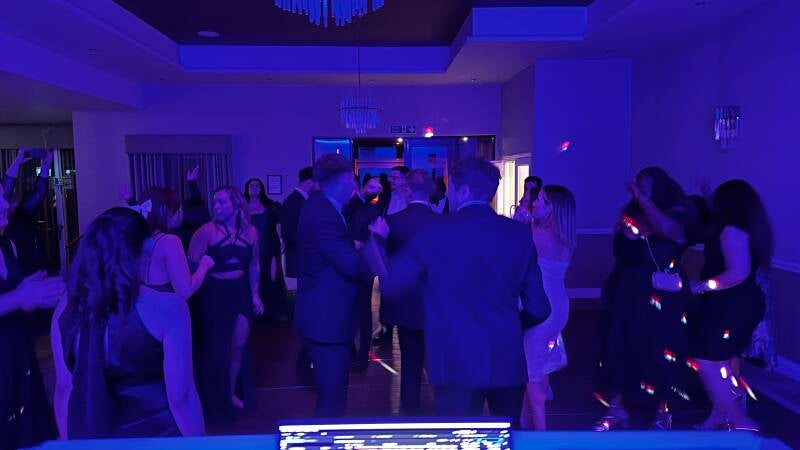 Corporate DJ in Warwick hotel ballroom with guests dancing