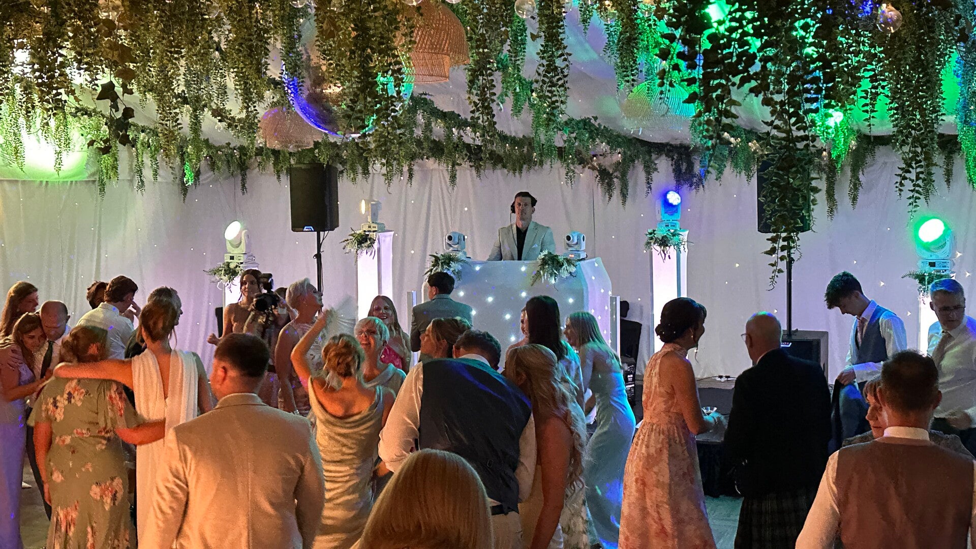 Standard evening wedding DJ setup and dancefloor lighting