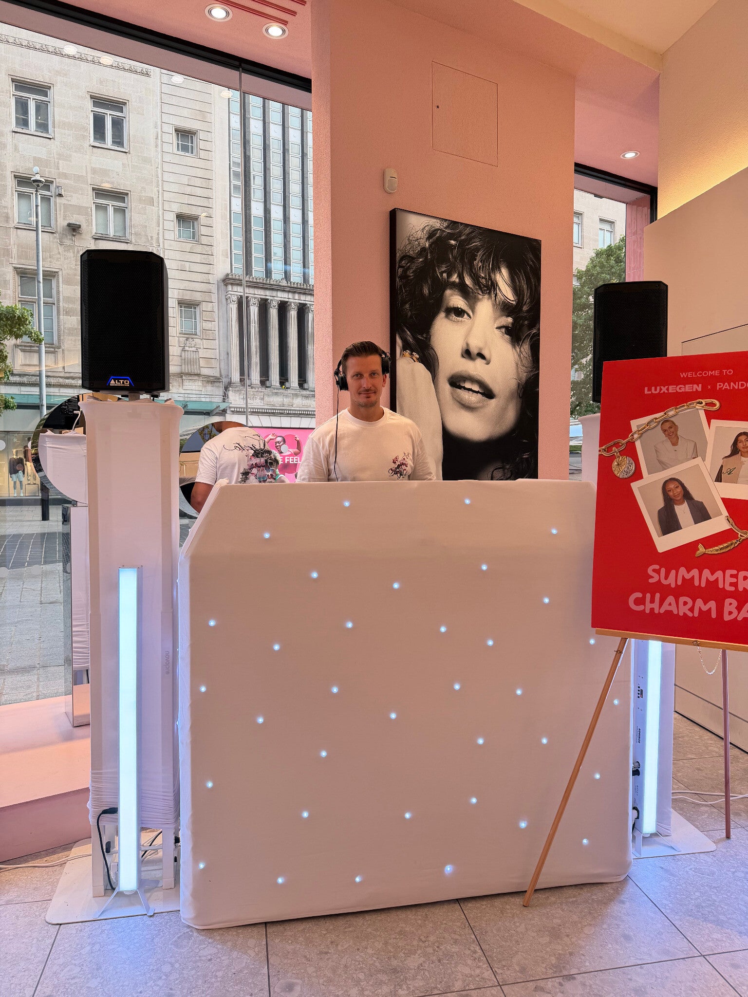 Matt Hall DJing at a Pandora event behind a white MHX booth