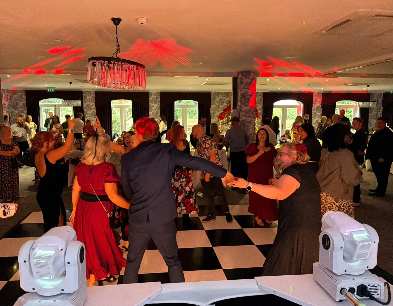 Wedding guests dancing together during an MHX performance