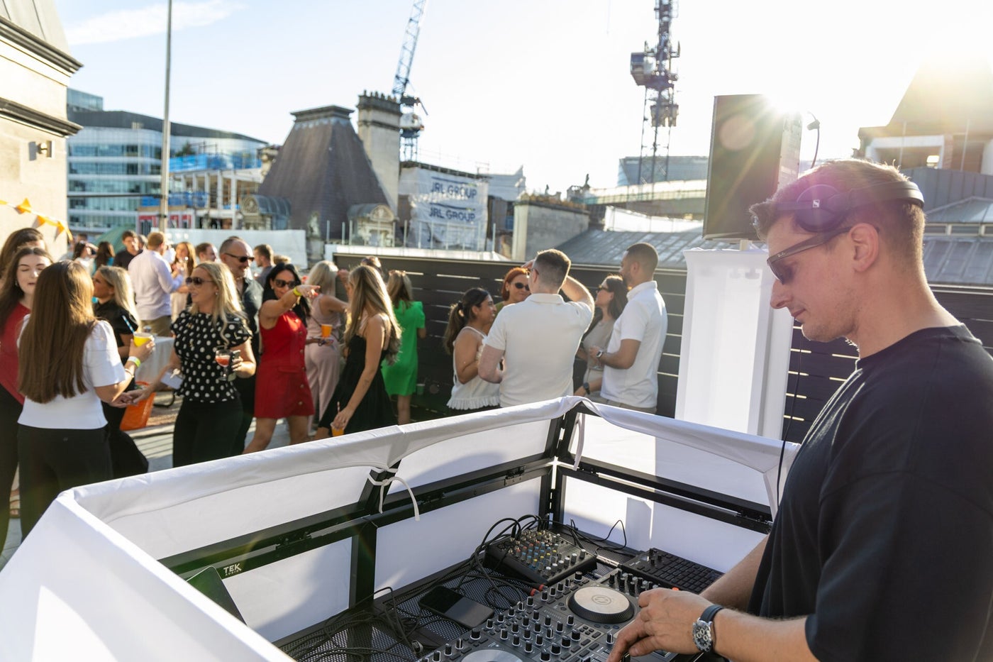 Matt Hall DJing for guests at a City of London rooftop event