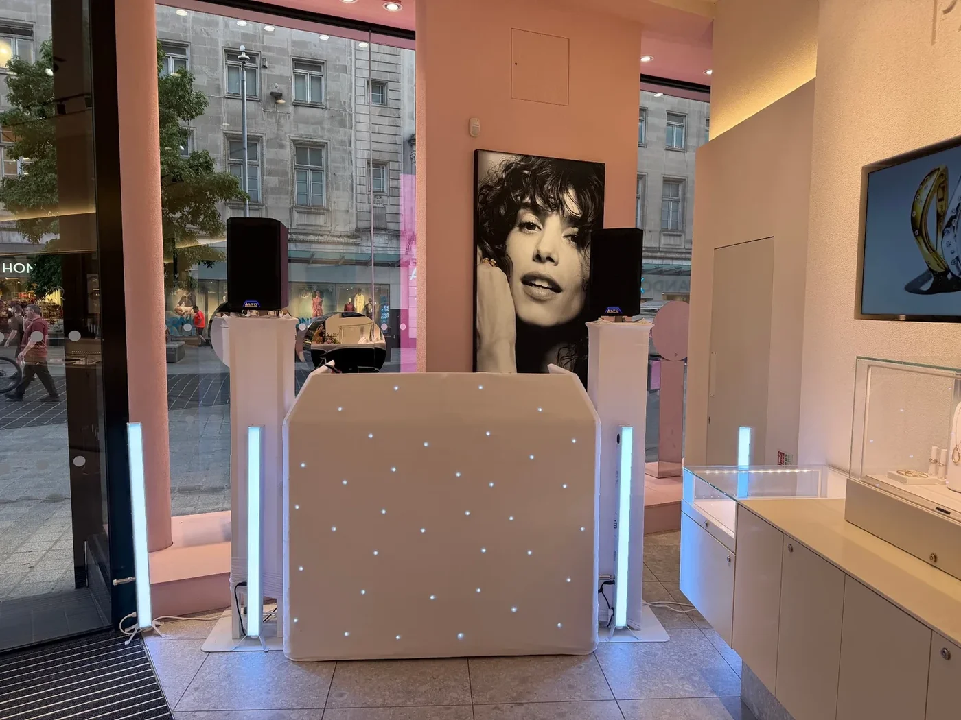 Clean white MHX DJ setup inside a Pandora store for a retail brand event